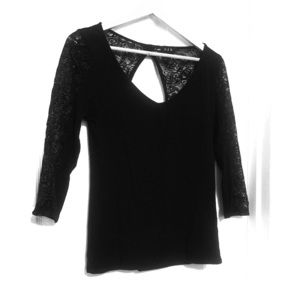 Black top with lace detail, peekaboo feature back